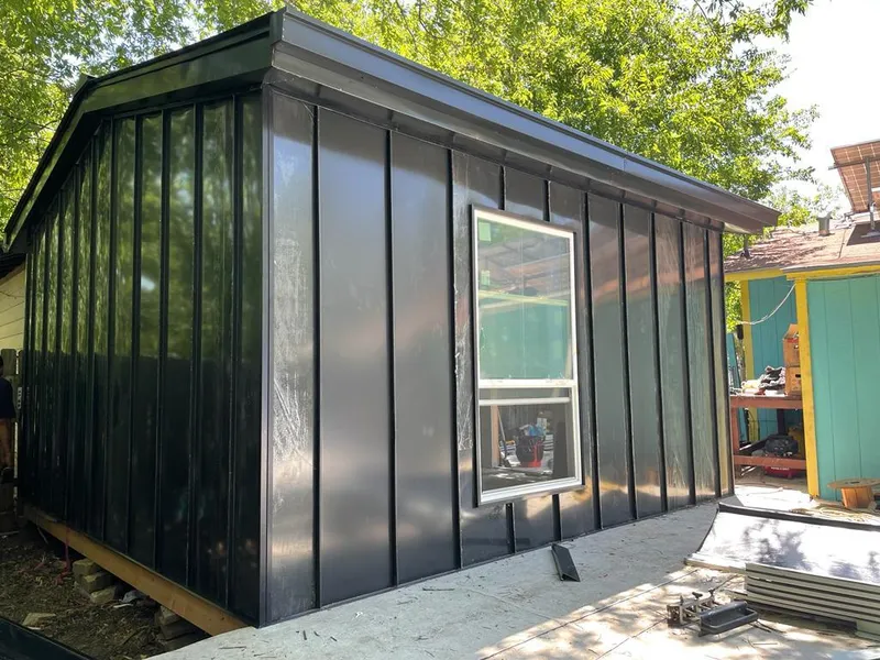 Black standing seam metal wall panels for Roof Inspection in Siesta Key