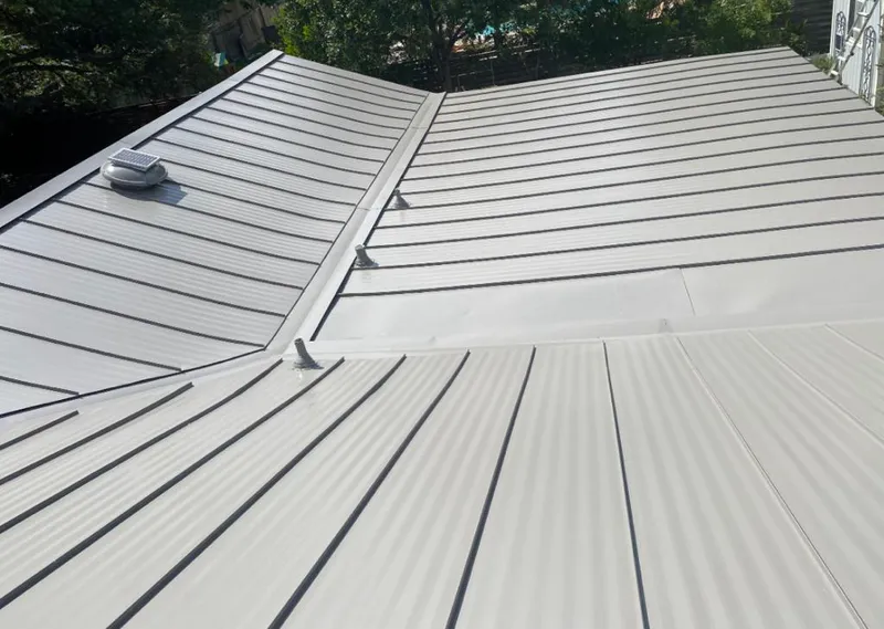 Solar attic fan installed on a metal roof for Roof Ventilation in Siesta Key